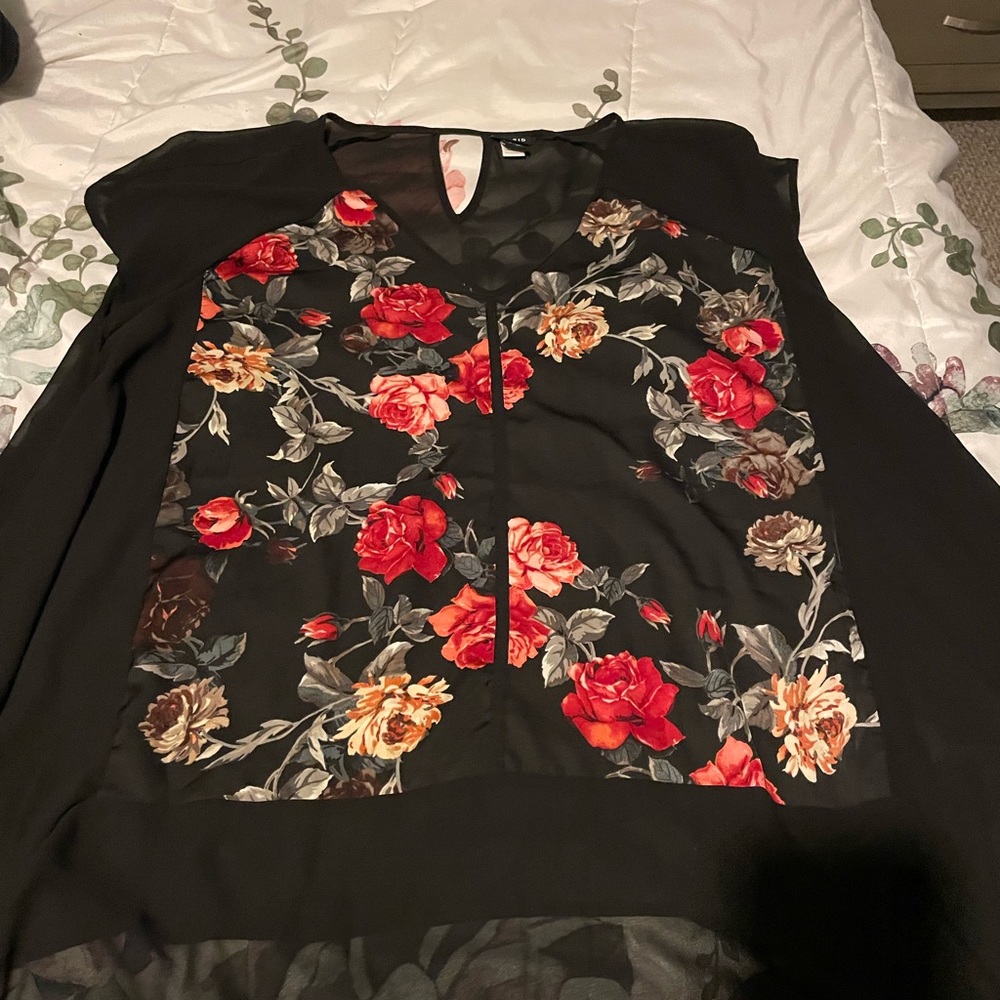 Torrid size 3. Black with rose print top. Partially sheer